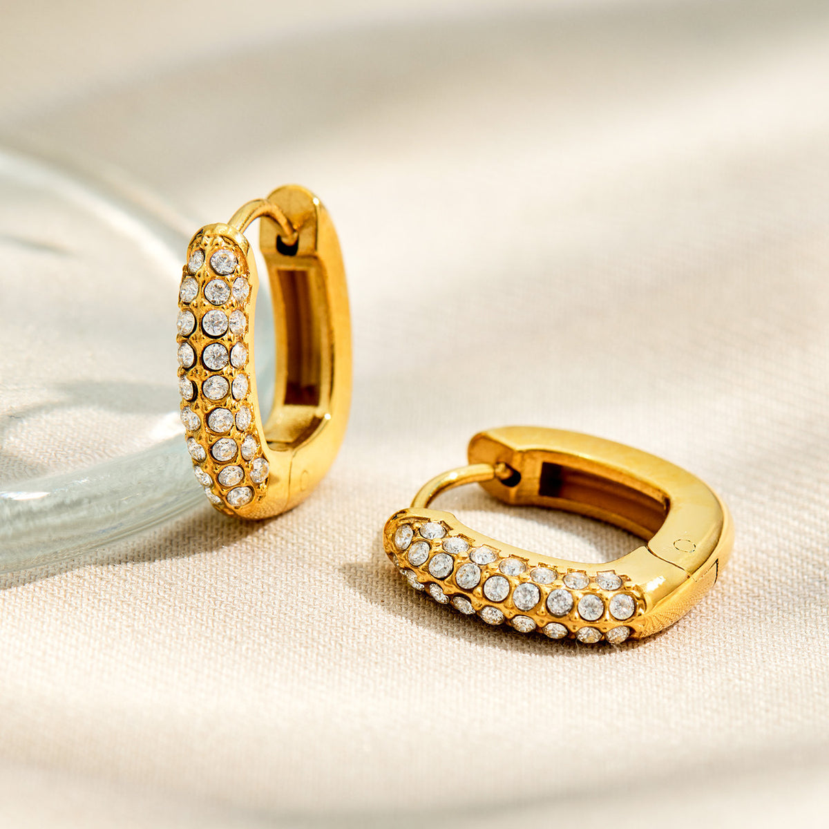 Selene huggie hoop earrings paved with two rows of zircon stones