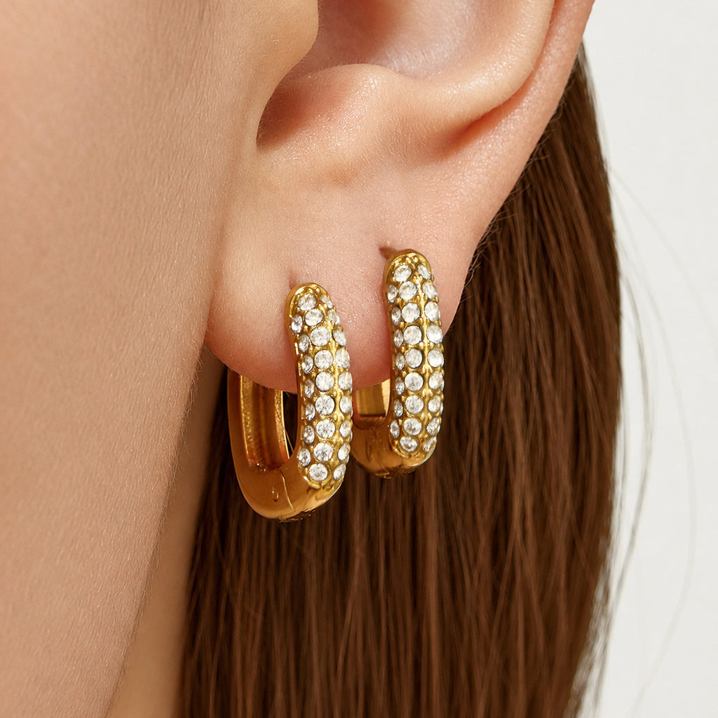 Selene gold huggie hoops worn as a pair