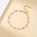 Venus Heart Bracelet in gold — polished hearts and clear stones with extender chain